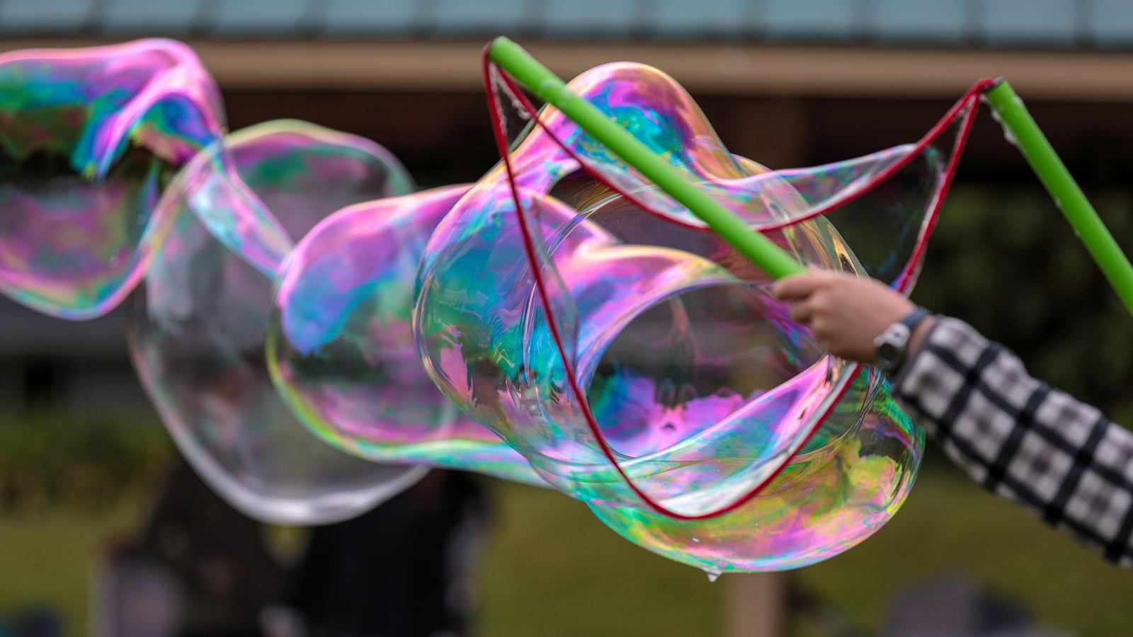 Woman holding large bubble wand