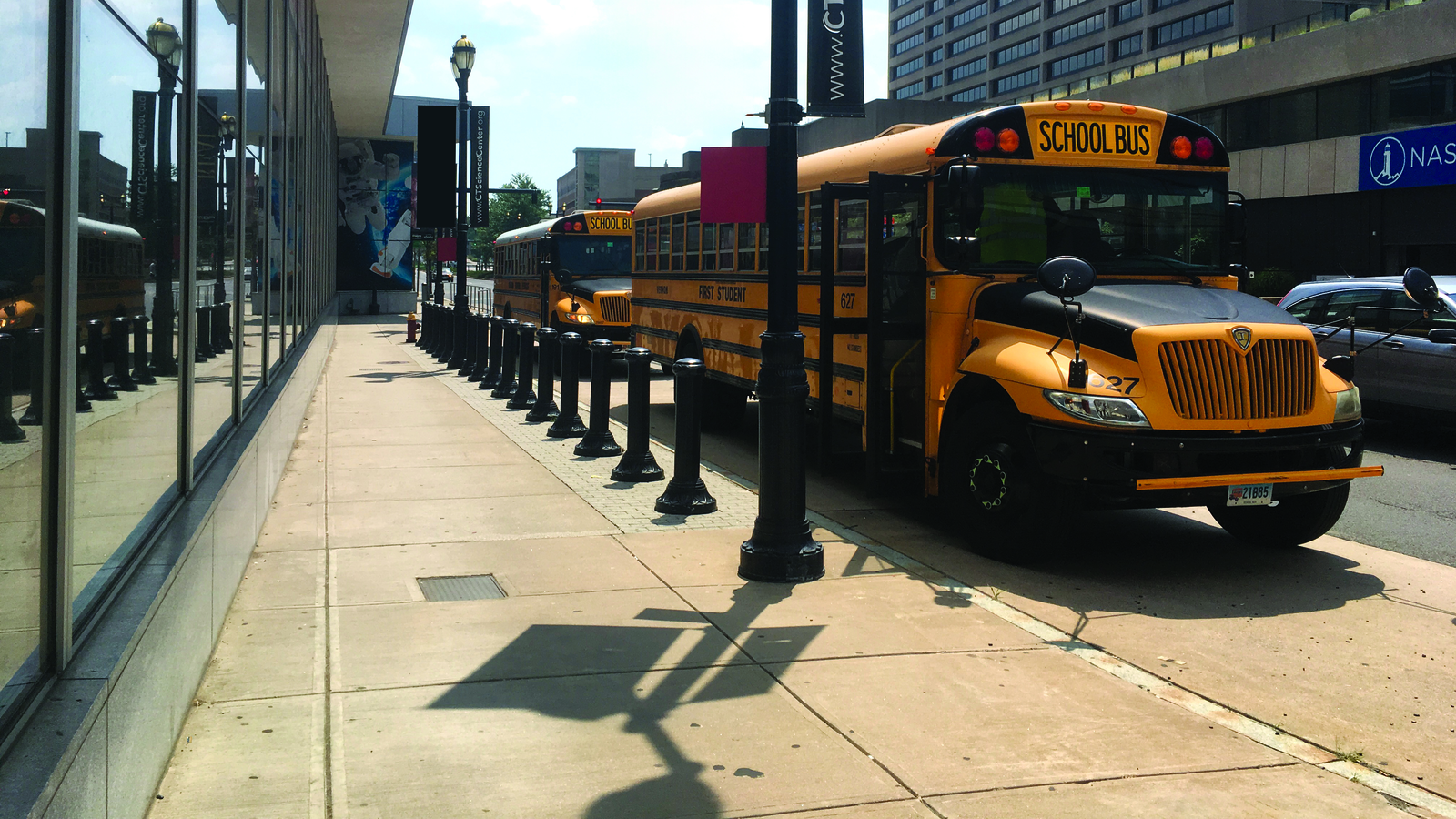 Field trip busses parked in front of the Connecticut Science Center