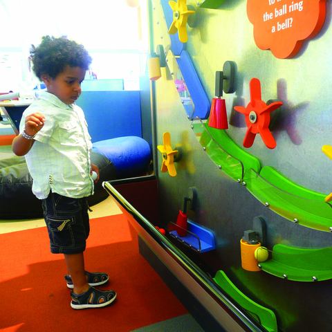 Toddler Playing with Wall